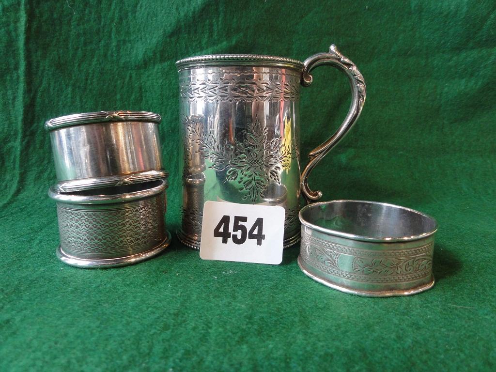 Appraisal: Three silver napkin rings and a small silver tankard London