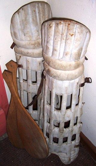 Appraisal: A pair of Edwardian cricket pads two wooden paddles