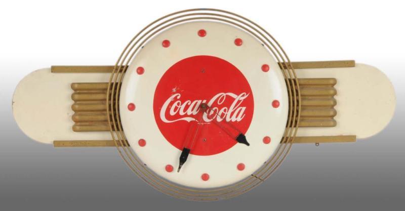 Appraisal: Metal Masonite Coca-Cola Electric Clock Description s A few small