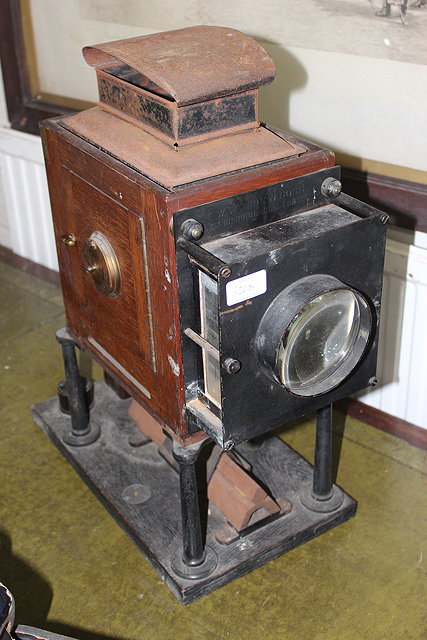 Appraisal: W WATSON SONS MAHOGANY AND LACQUERED BRASS PROJECTOR on stand