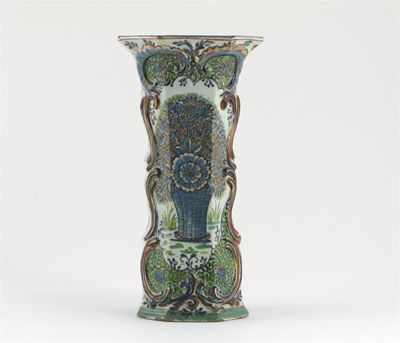 Appraisal: A Delft octagonal vase with moulded rococo scrolls painted in