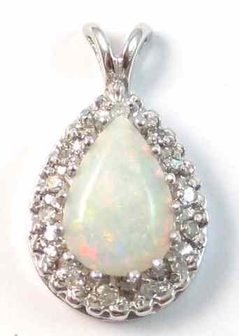 Appraisal: OPAL CABOCHON AND DIAMOND PENDANT k white gold set with