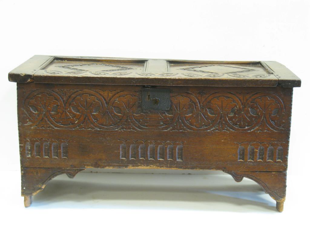 Appraisal: An antique oak Coffer with carved and panelled top ft