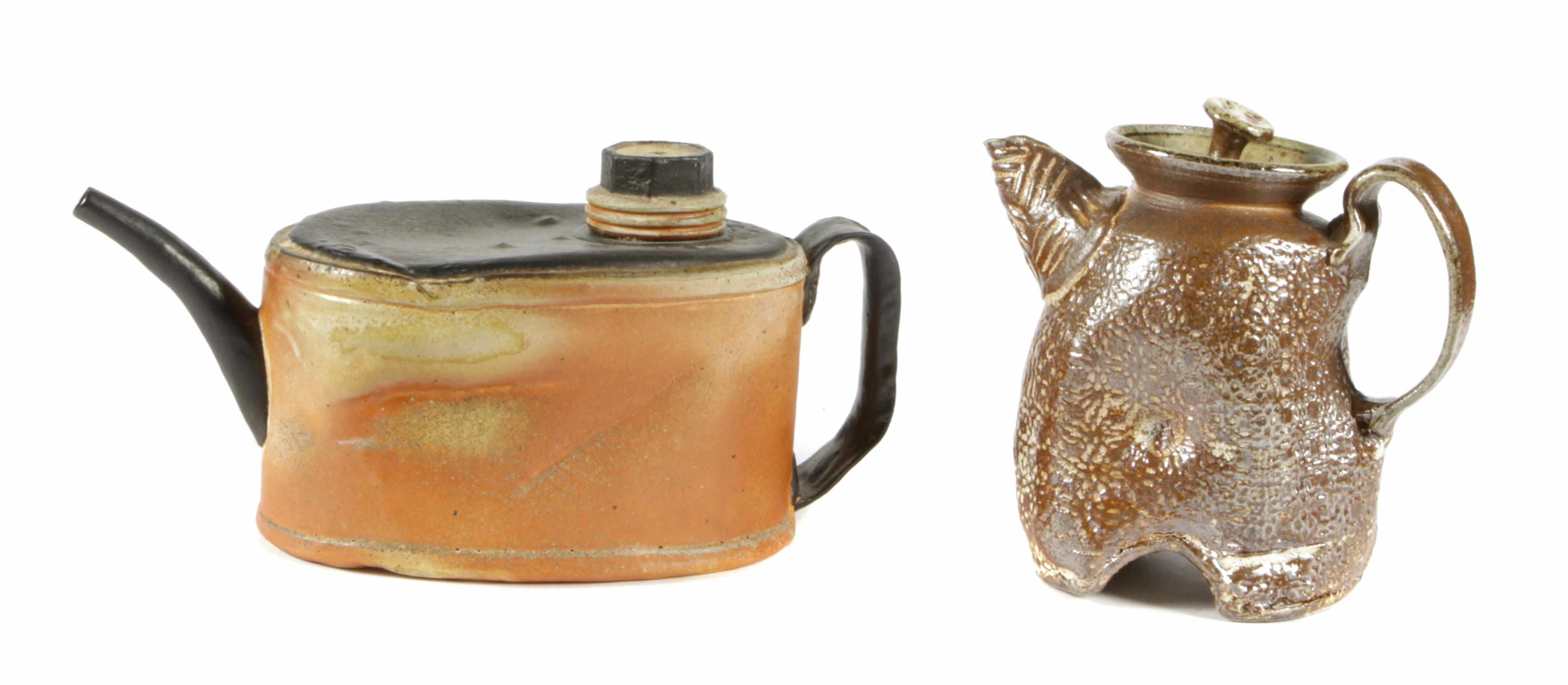 Appraisal: A group of two glazed earthenware teapot sculptures unsigned one