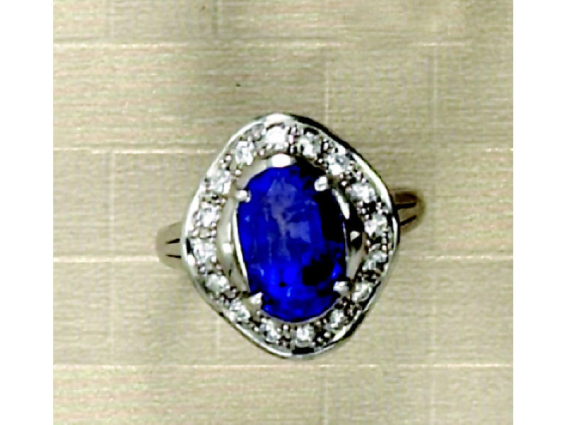 Appraisal: SAPPHIRE AND DIAMOND RING Platinum ring set with one oval