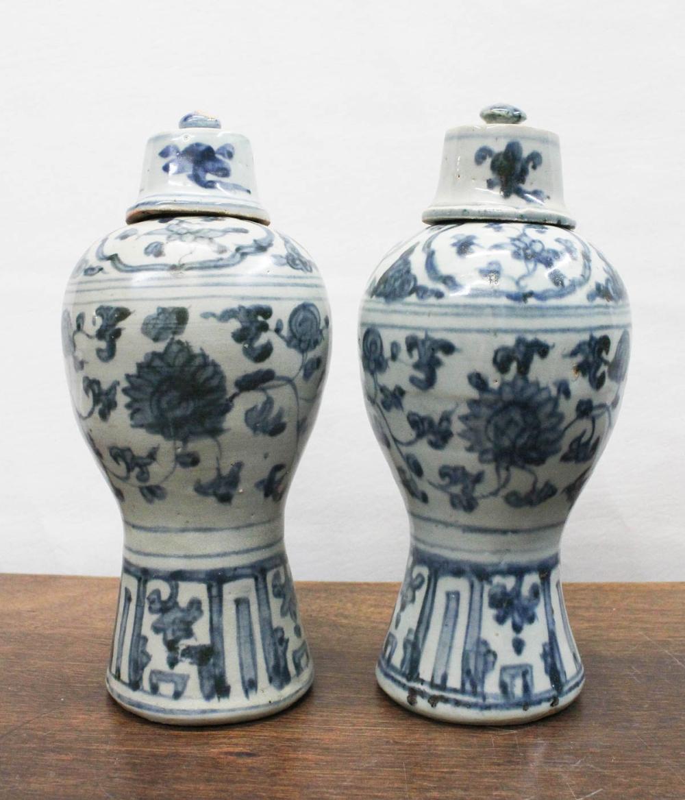 Appraisal: PAIR OF CHINESE BLUE AND WHITE PORCELAIN LIDDED URNS of