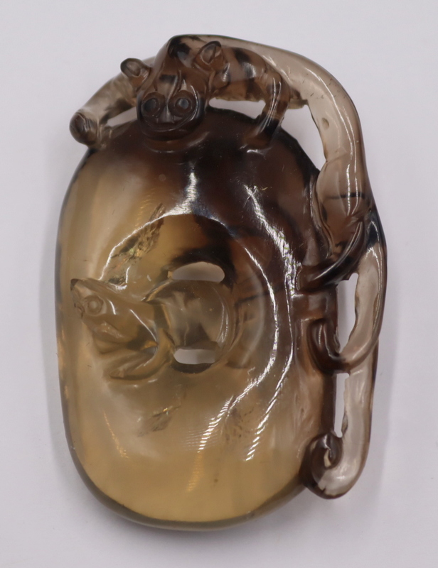 Appraisal: Chinese Carved Tea Crystal Figural Pendant Chinese carved tea crystal