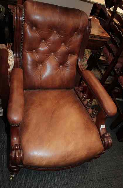 Appraisal: A VICTORIAN MAHOGANY ARMCHAIR with scroll back baluster turned supports