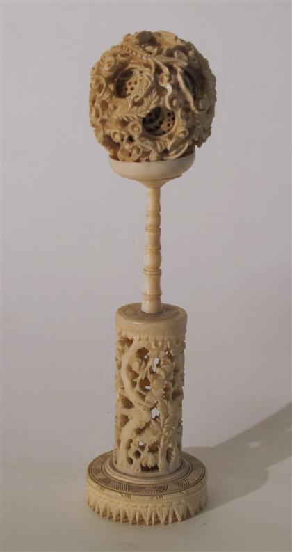 Appraisal: Chinese carved elephant ivory puzzle ball on standlate Qing dynasty