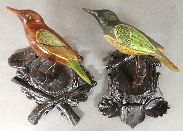 Appraisal: - Two similar Black Forest carved and polychrome decorated birds