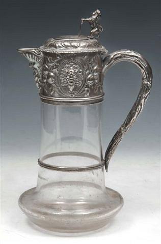 Appraisal: A VICTORIAN SILVER MOUNTED GLASS CLARET JUG the mount chased