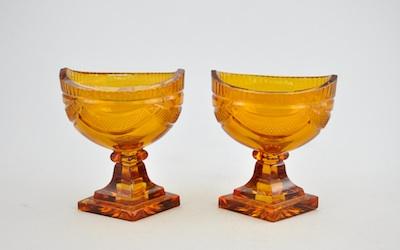 Appraisal: A Pair of Amber Cut Glass Master Salts Boat shape