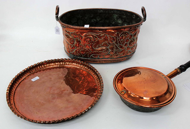 Appraisal: A TH CENTURY COPPER FOOTBATH with embossed scrolling floral decoration