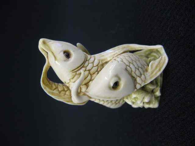 Appraisal: Carved Ivory Netsuke of Two Catfish onyx eyes signed ''