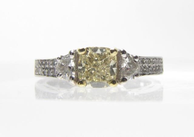 Appraisal: An K white gold ring with ct cushion cut fancy