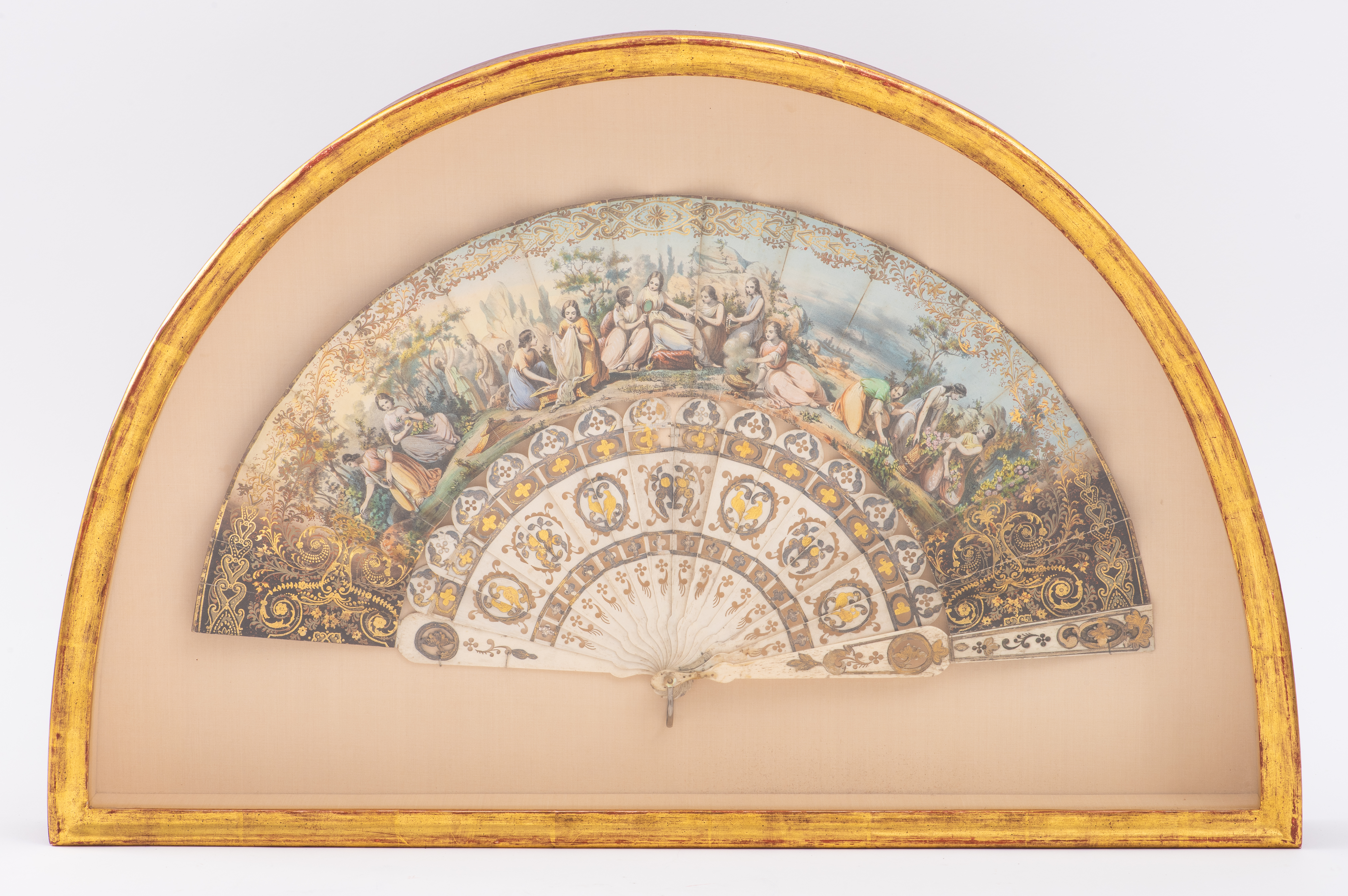 Appraisal: FRENCH POLYCHROME AND GILT-DECORATED FAN CA French polychrome lithographed and