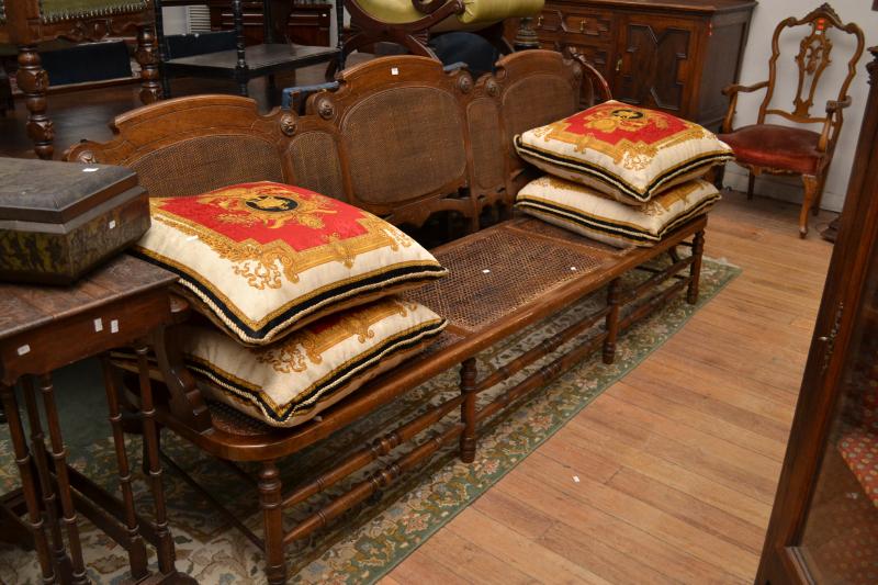 Appraisal: A FOUR SEAT ANTIQUE STYLE BENCH WITH RATTAN INSETS A