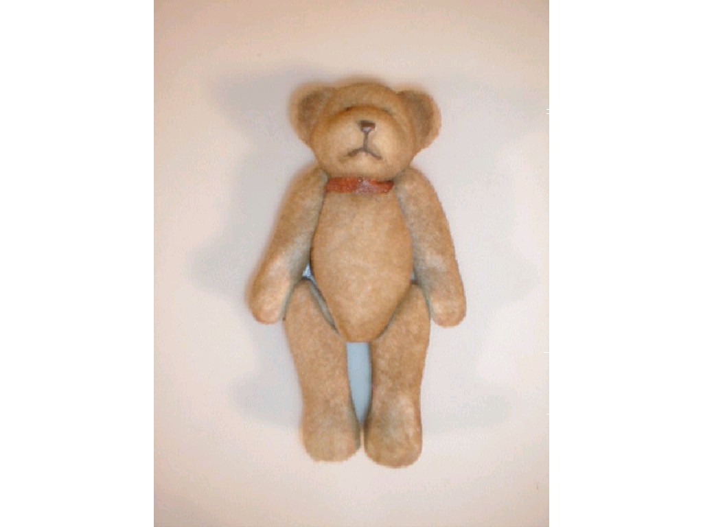 Appraisal: A small plush covered metal based teddy bear articulated limbs