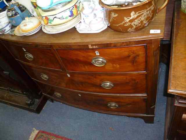 Appraisal: A MAHOGANY BOW FRONTED CHEST of two short and two