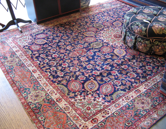 Appraisal: PERSIAN MASHAD CARPET hand knotted in a central floral medallion