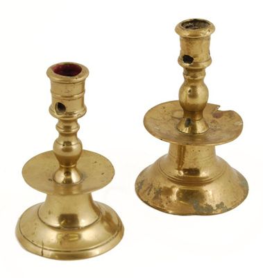 Appraisal: A th century Dutch brass candlestick raised on a low