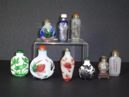 Appraisal: A collection of Chinese glass snuff bottles comprising a carved