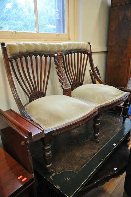 Appraisal: AN EDWARDIAN TWO SEATER SETTEE