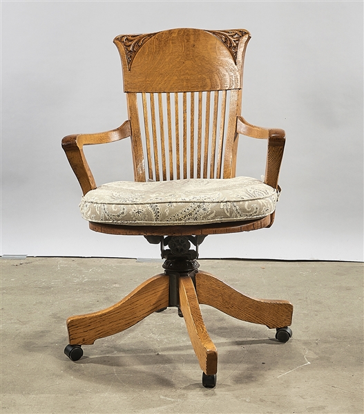 Appraisal: Wood swivel arm desk chair partial slat back with cushion