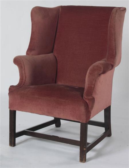 Appraisal: An early th century mahogany framed wing armchair the whole