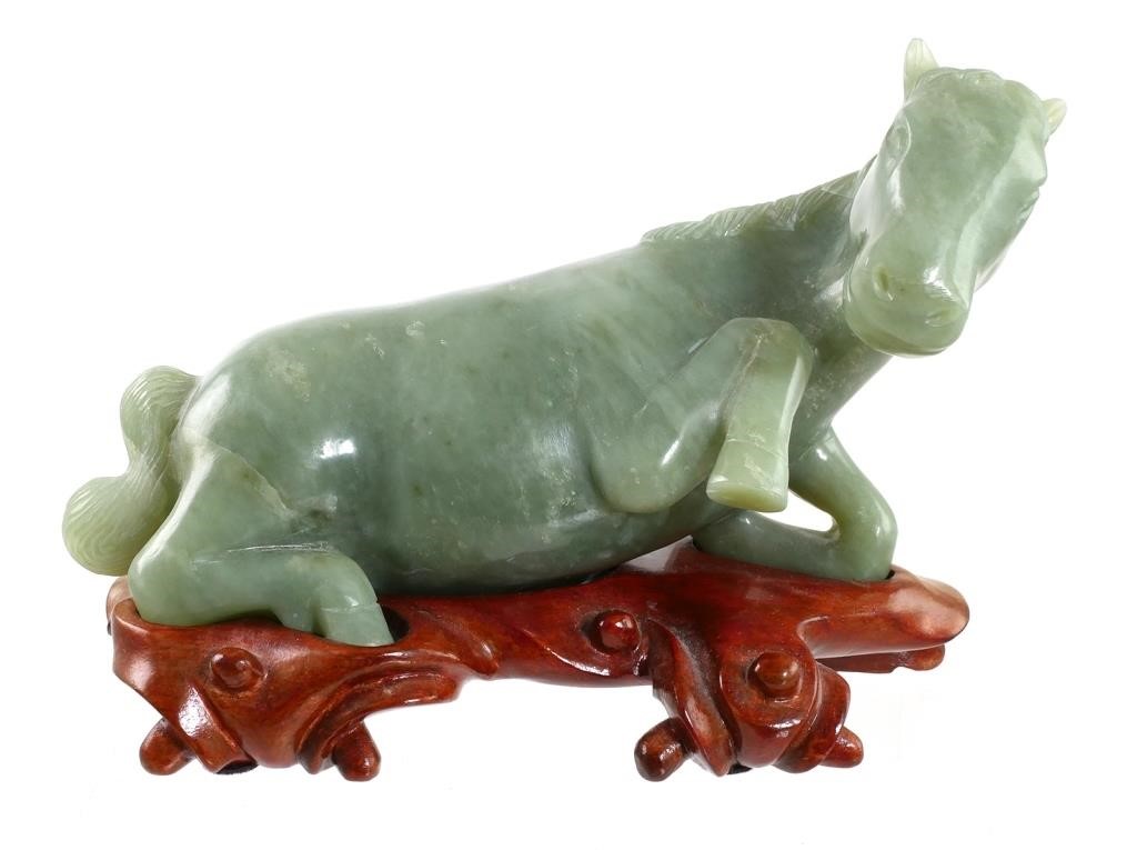 Appraisal: Hand carved jade horse lying down Sits on custom carved