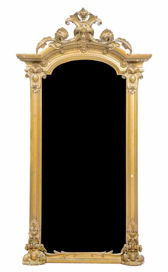 Appraisal: A Victorian Giltwood Pier Mirror having a scrolling foliate domed