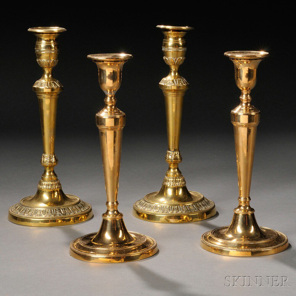 Appraisal: Two Pairs of Brass Candlesticks c a pair of French