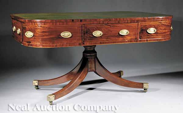 Appraisal: A Regency-Style Inlaid Mahogany Rent Table th c the elliptical