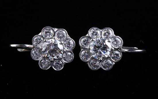 Appraisal: PAIR PLATINUM AND DIAMOND FLORAL MOTIF EARRINGS Flowerheads set throughout