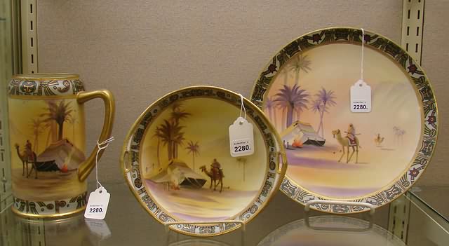 Appraisal: Plate dish and tankard all featuring camel and rider design