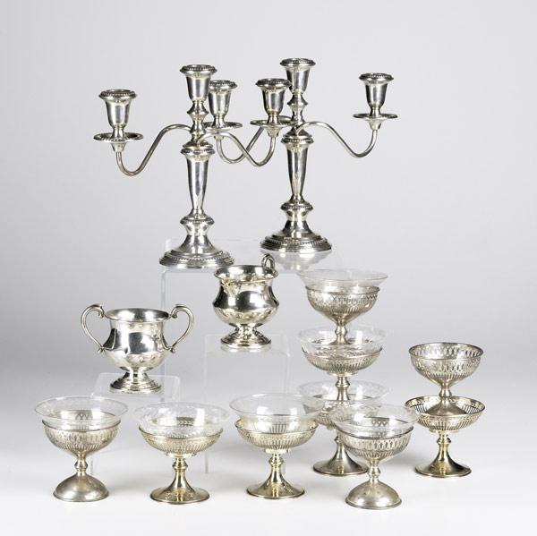 Appraisal: AMERICAN SILVER Pair of two arm weighted candelabra nine sterling