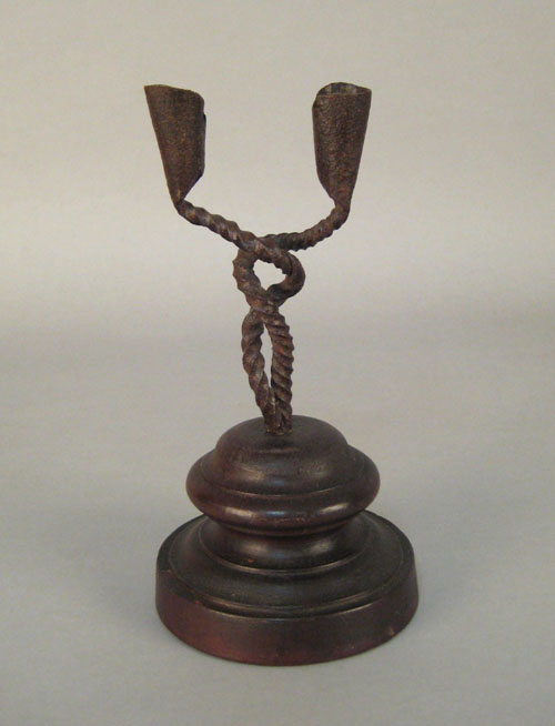 Appraisal: Wrought iron double cup candlestick th th c with a