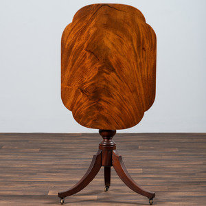 Appraisal: A Late Chippendale Figured Mahogany Tablet Tilt-Top Candlestand Likely Pennsylvania