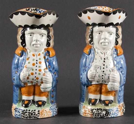 Appraisal: Pair of Staffordshire pearlware toby jugs early th century both