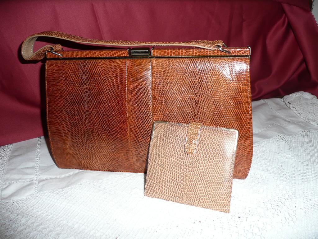 Appraisal: A Mappin Webb skin handbag with matching wallet