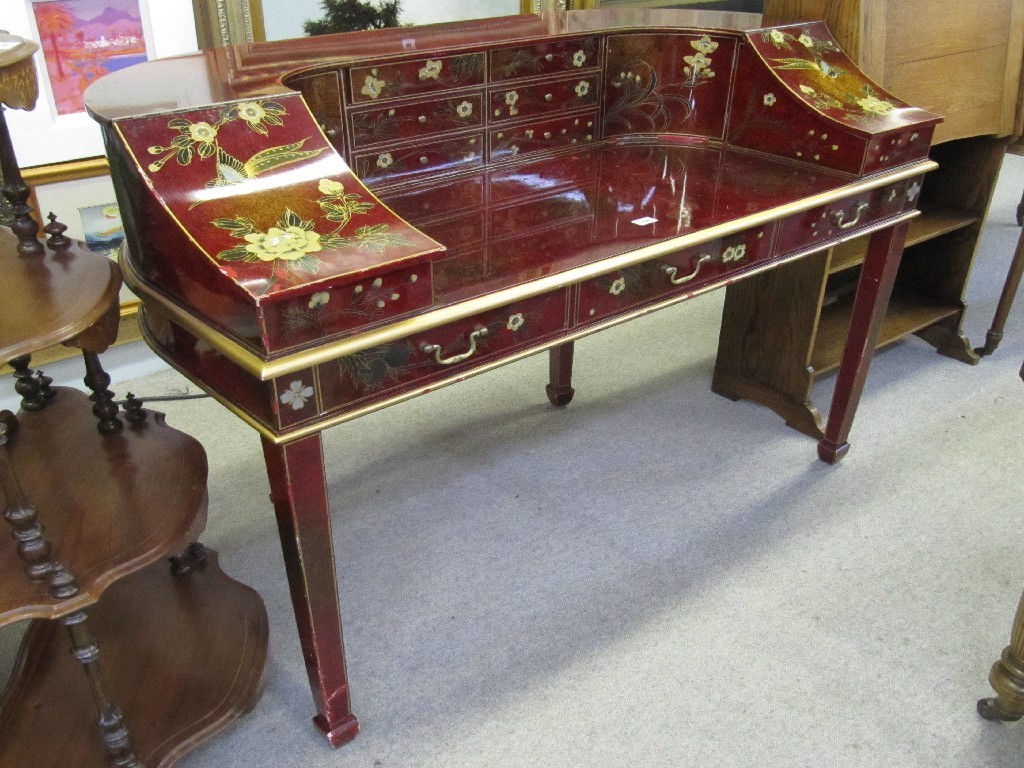 Appraisal: Oriental red lacquered desk with floral decoration