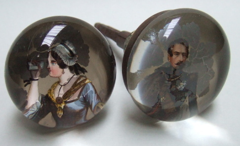 Appraisal: Two glass circular door knobs each glazed with a printed