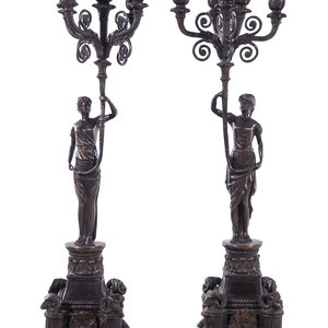 Appraisal: A Pair of Empire Style Silvered Metal Figural Five-Light Candelabra