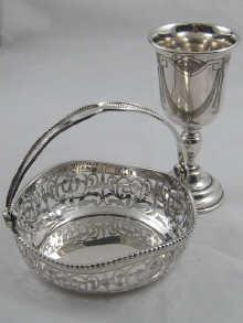 Appraisal: A silver pierced bon bon dish with swing handle hallmarked