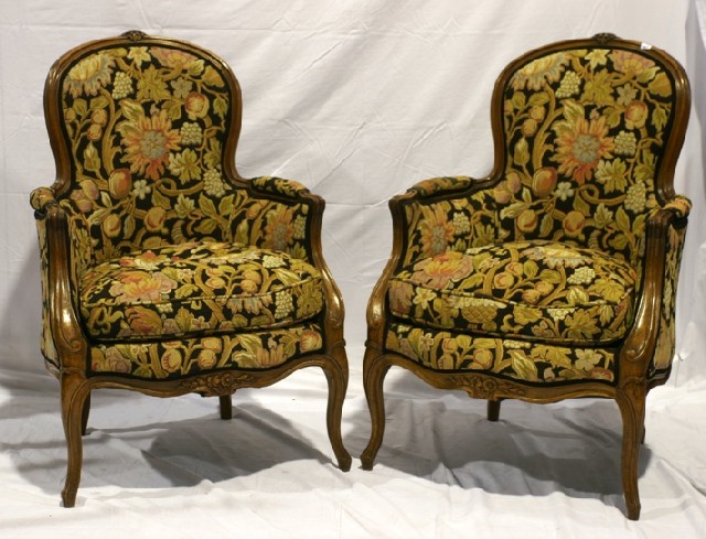 Appraisal: A pair of Louis XV style stained beech bergeres upholstered