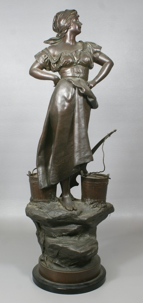 Appraisal: White metal sculpture of a woman with buckets water signed