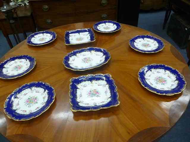 Appraisal: A MINTONS PART DESSERT SERVICE with dark blue border and