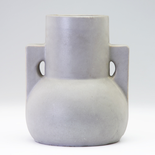 Appraisal: TECO Architectural vase with two angular buttressed handles covered in