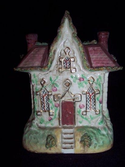 Appraisal: A Staffordshire pastille burner a cottage with central gable the