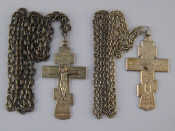 Appraisal: Two cast silver pectoral crucifixes on heavy chains Wt gm